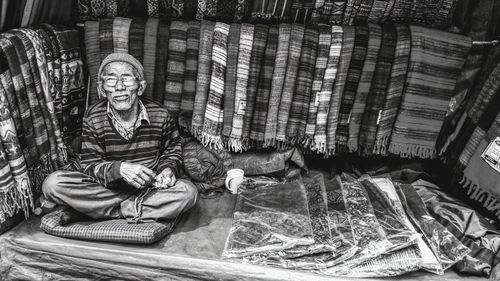 Portrait of woman sitting on bed