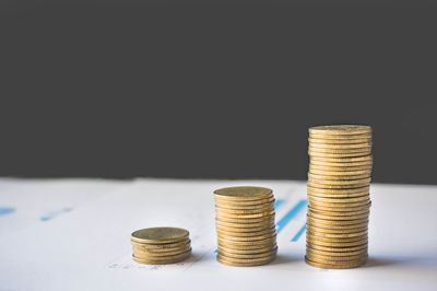 Stack of objects on table against black background