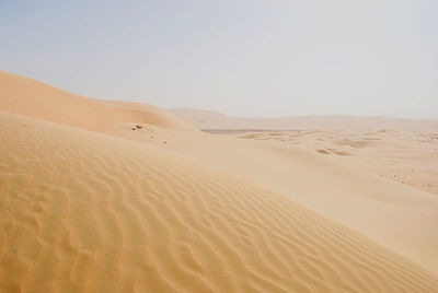 Scenic view of desert against clear sky