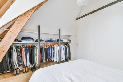 High angle view of clothes hanging on bed at home