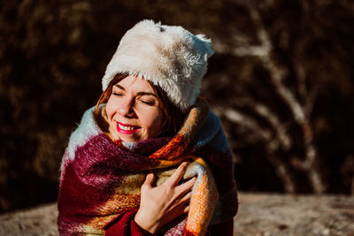 Portrait of a smiling young woman during winter