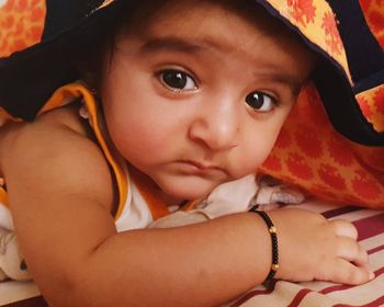 Close-up portrait of cute baby at home