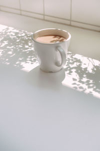 High angle view of coffee cup on table