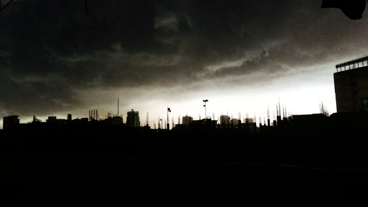 silhouette, sky, building exterior, built structure, architecture, sunset, cloud - sky, dusk, low angle view, bird, cloudy, cloud, nature, flying, house, building, animal themes, outdoors, overcast, weather