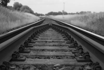 Close-up of railroad track against sky