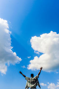 Low angle view of statue against blue sky