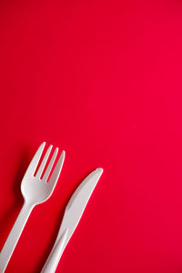 High angle view of plastic on red background