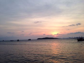 Scenic view of sea against sky at sunset