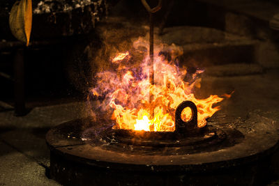 Close-up of fire burning at night