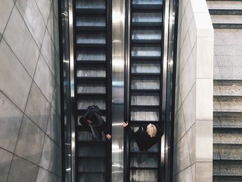 High angle view of people on escalator at subway