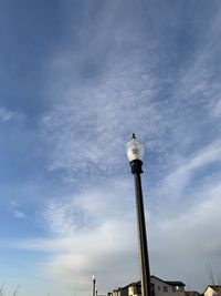 Low angle view of statue against cloudy sky