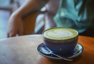 Close-up of coffee cup on table