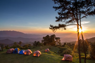 Tent on landscape against sky