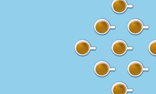 Directly above shot of coffee against blue background