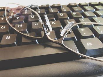 Close-up of eyeglasses on keyboard