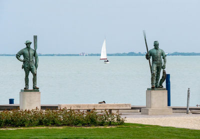 Sculptures of fisher and ferryman at the lake balaton in hungary