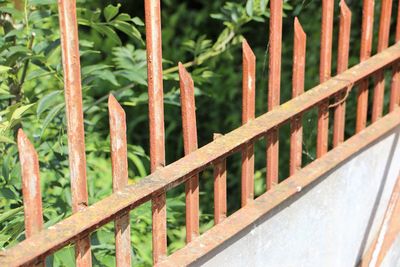 Close-up of railing by fence