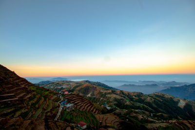 Scenic view of mountains against sky during sunset