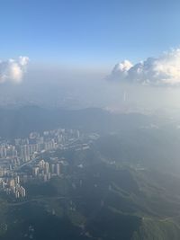 High angle view of buildings in city against sky