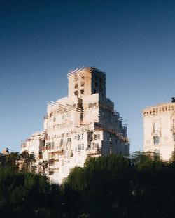 Low angle view of buildings against clear sky