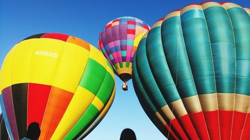 Low angle view of hot air balloons against sky