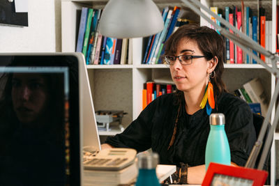 Portrait of woman using mobile phone