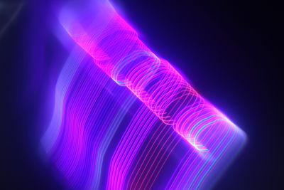 Close-up of light painting against black background