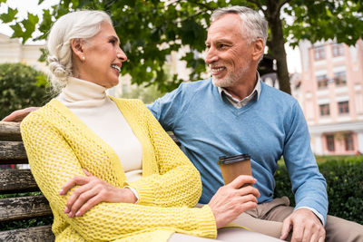 Man and woman sitting outdoors