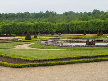 Scenic view of formal garden against sky