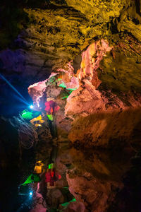 High angle view of illuminated rock formation in lake