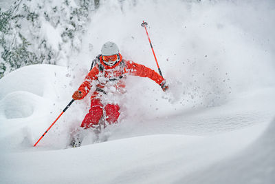 Adult man skiing in deep powder snow in the backcountry, werfenweng, austria