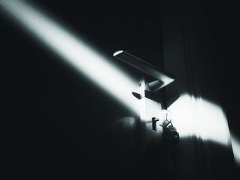 Low angle view of illuminated lamp post at night