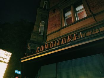 Low angle view of illuminated building at night