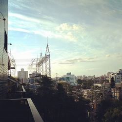 Buildings against cloudy sky