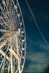 Low angle view of ferris wheel against sky