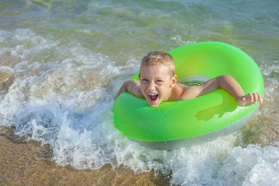 Portrait of smiling boy in swimming pool