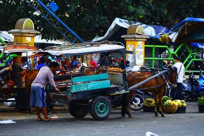 People at market stall in city