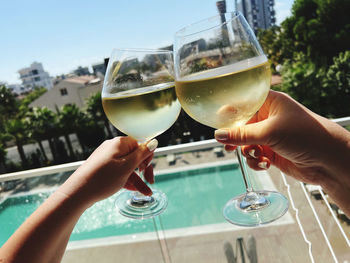 Cropped hand of woman holding wineglass