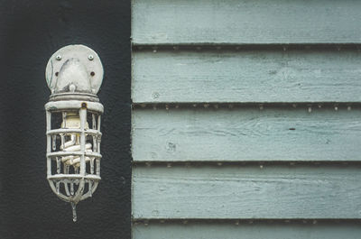 Frozen energy efficient lightbulb mounted on wall