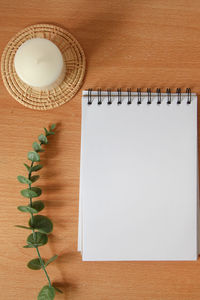 Directly above shot of book with pencil on table