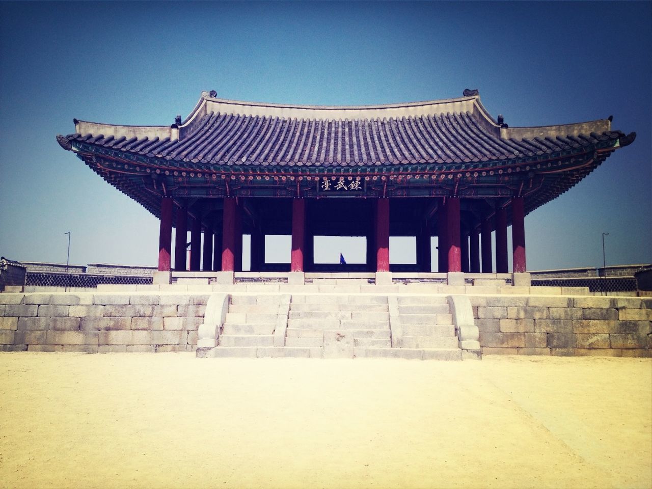 architecture, built structure, building exterior, place of worship, clear sky, religion, spirituality, facade, history, roof, entrance, temple - building, low angle view, exterior, temple, famous place, steps, blue, sky, travel destinations