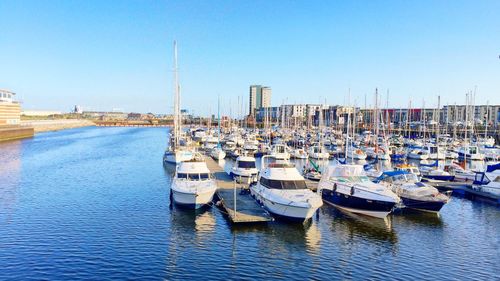 Boats moored at harbor