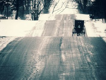 Man riding motorcycle on road