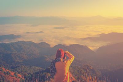 Scenic view of mountain range against sky during sunset