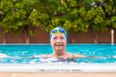 Portrait of senior woman in swimming pool