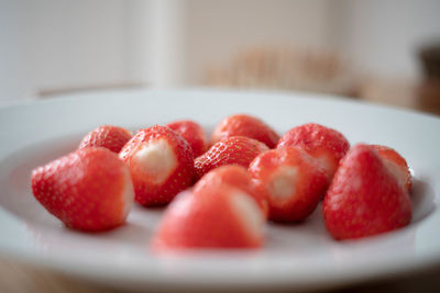 Close-up of strawberries in plate on table