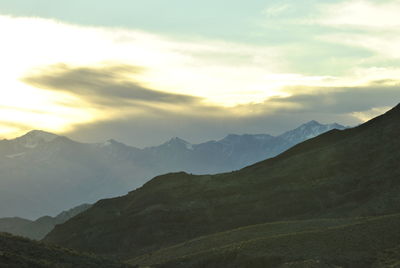 Scenic view of mountains against sky during sunset