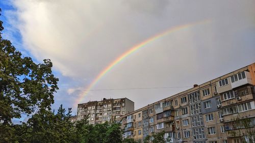 Low angle view of rainbow in city