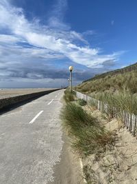 Empty road against sky