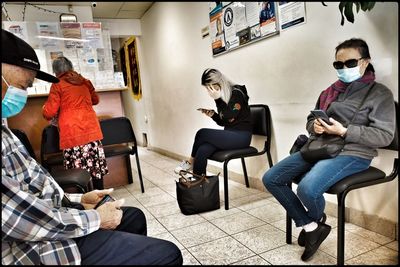 Group of people sitting on chair